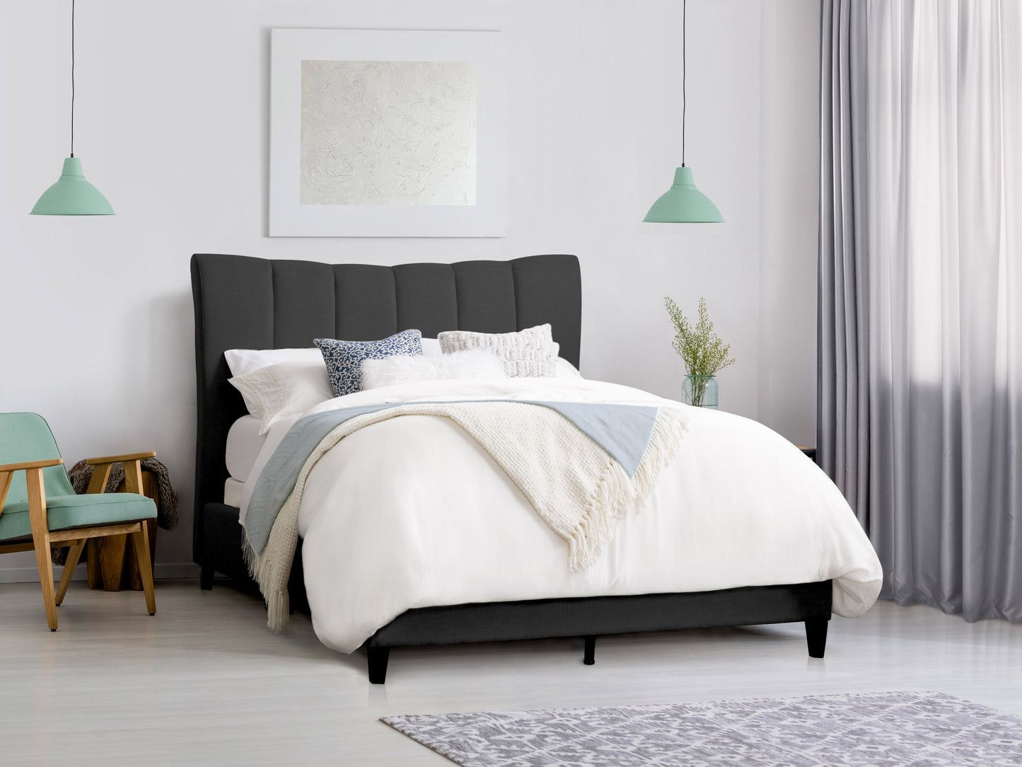 Dark grey channel tufted queen bed with upholstered headboard and sleek modern design.