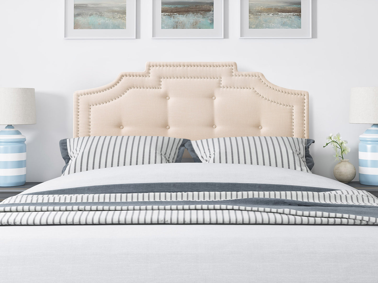 Cream padded queen headboard with tufted design and plush texture, perfect for modern bedroom decor.