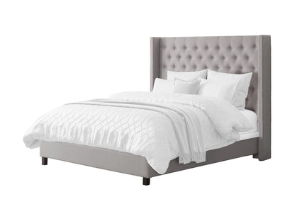 Grey tufted queen bed with slats, upholstered fabric, wooden legs, and elegant button detailing.