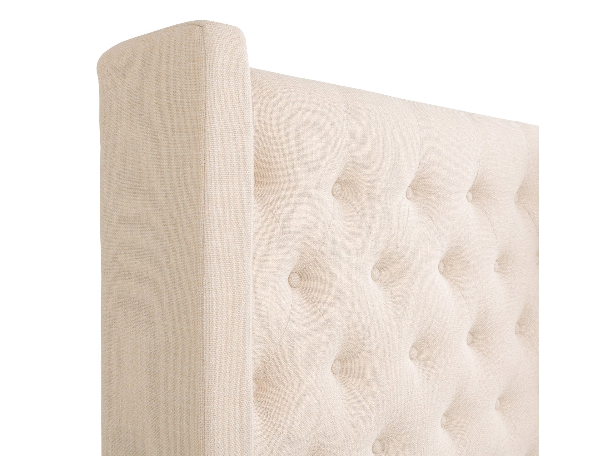 Cream tufted king bed with slats, upholstered headboard, and wooden legs for a modern bedroom.