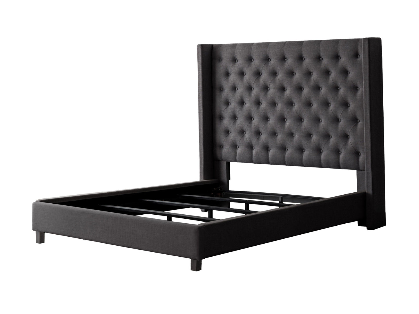 Dark grey tufted king bed with plush fabric, wooden legs, and elegant button detailing.