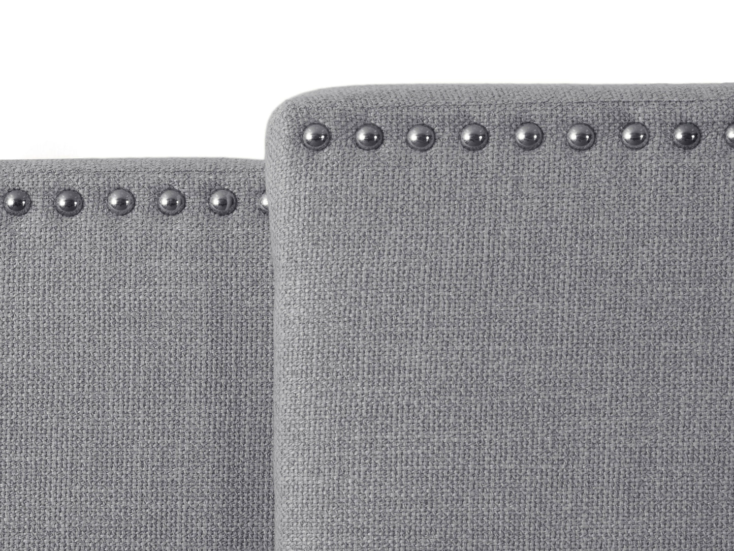 Adjustable grey fabric headboard with button-tufted design and padded upholstery.