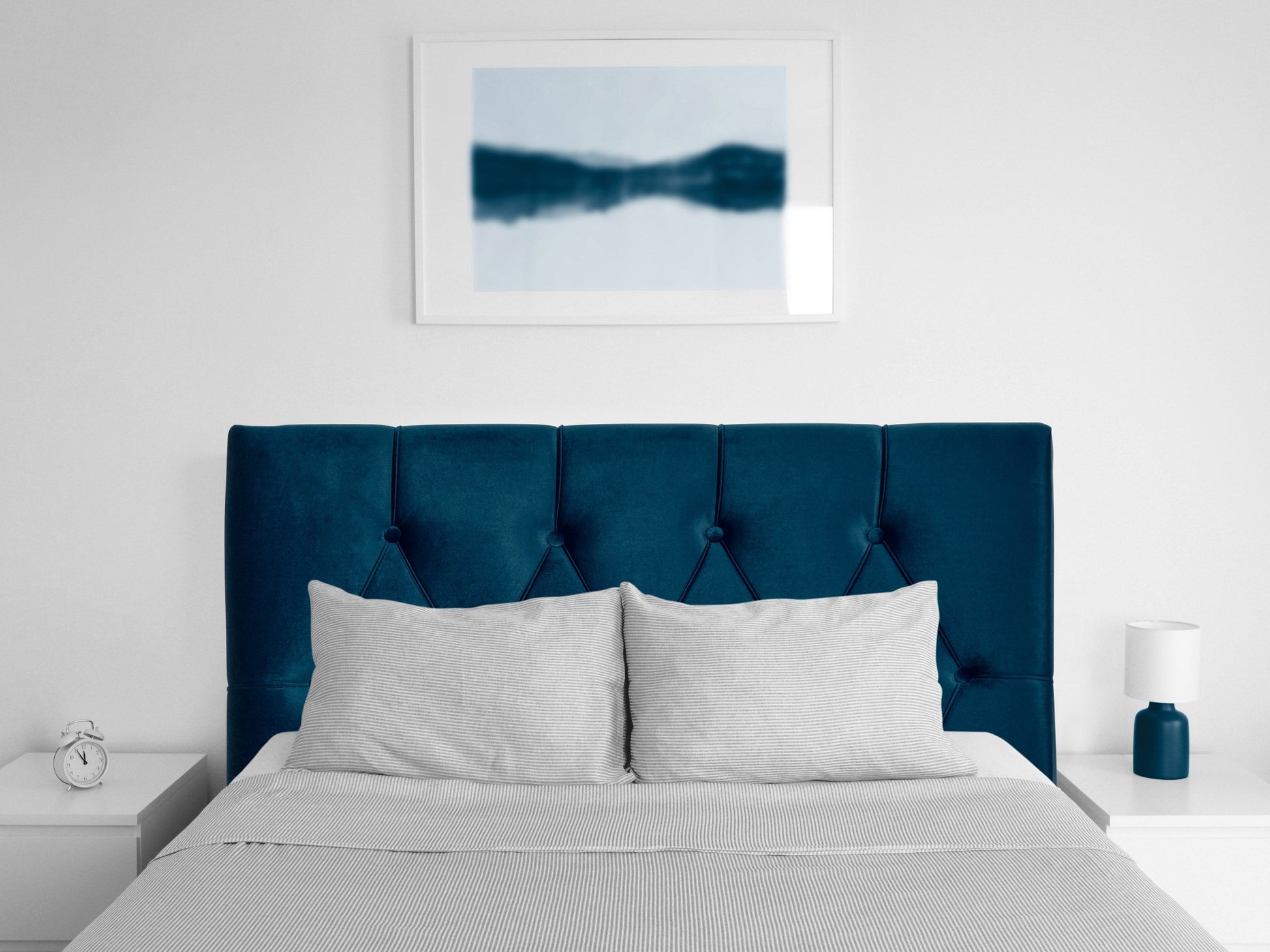 Navy blue velvet twin headboard with tufted design and elegant, plush texture for a luxurious bedroom upgrade.