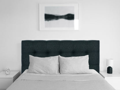 Blue twin headboard with modern design, tufted upholstery, and sleek lines for contemporary bedrooms.