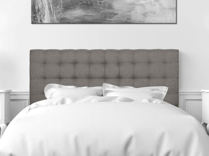 Modern grey upholstered queen headboard with vertical tufting and sleek minimalist design.