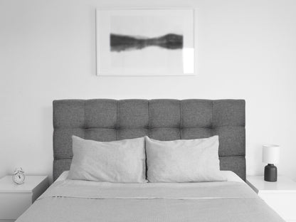 Grey twin headboard with tufted fabric, modern design, and wooden frame for stylish bedroom decor.