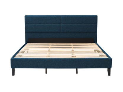 Blue upholstered king bed with tufted headboard, wooden legs, and elegant design.