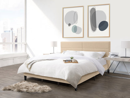 Cream upholstered king bed with tufted headboard, wooden legs, and modern design.