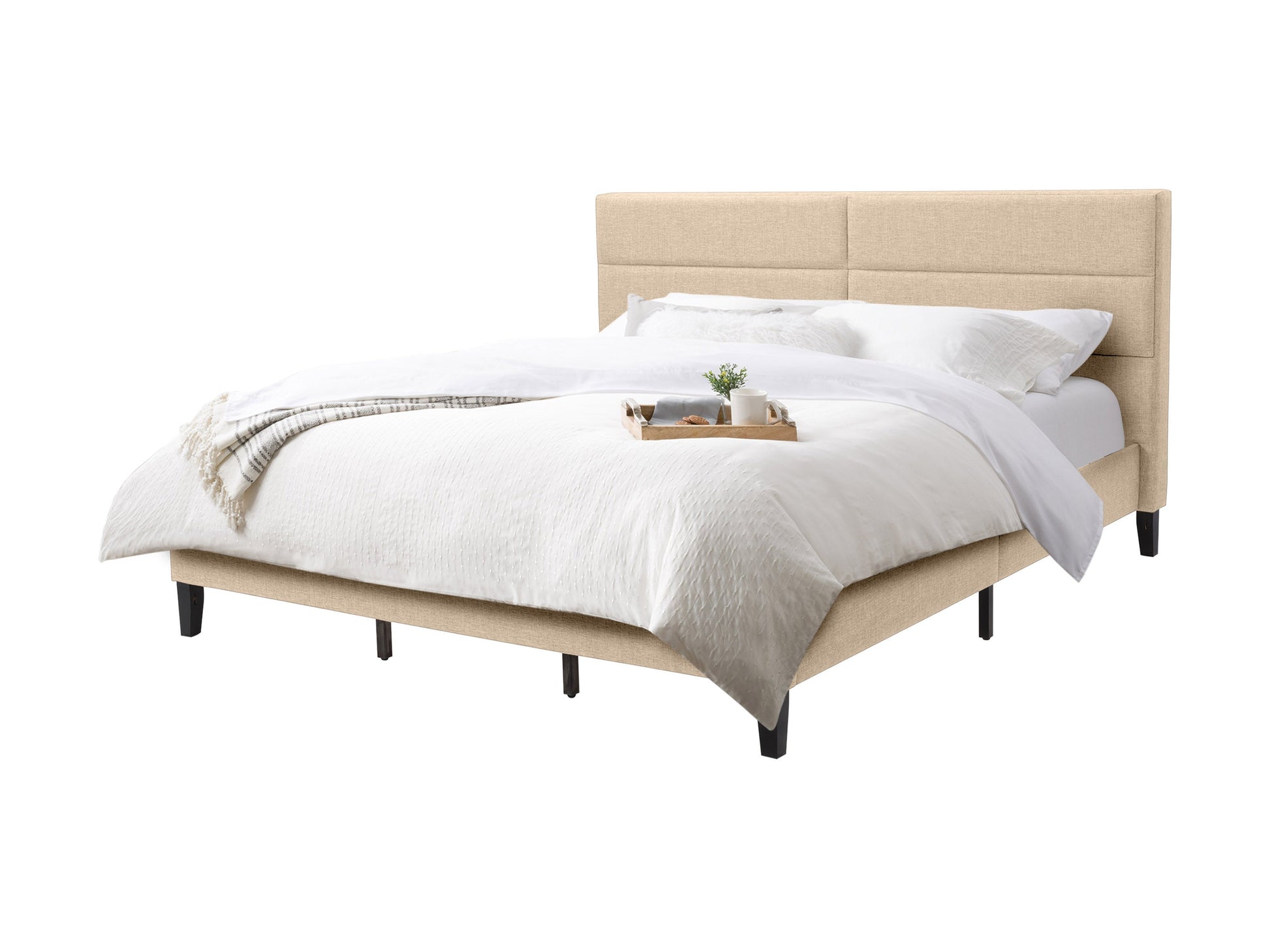 Cream upholstered king bed with tufted headboard, wooden legs, and elegant design.