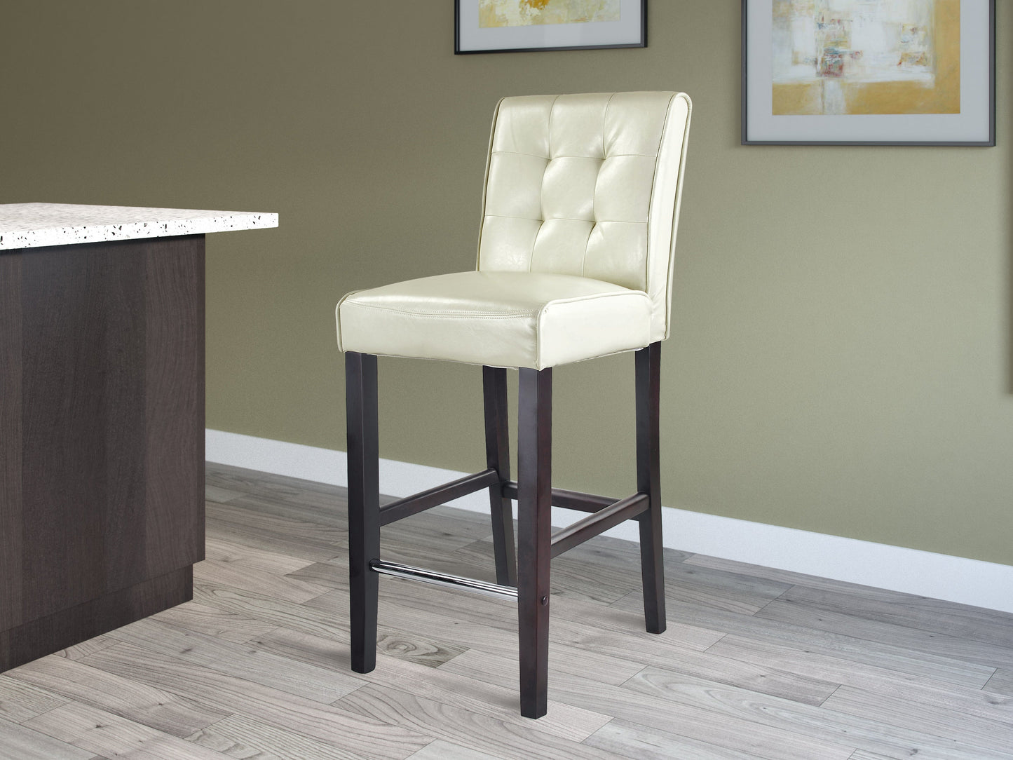 Cream bar height stool with cushioned seat, wooden legs, and a sleek, modern design.