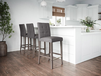 Silver grey fabric bar height stool with sleek metal legs and tufted backrest.