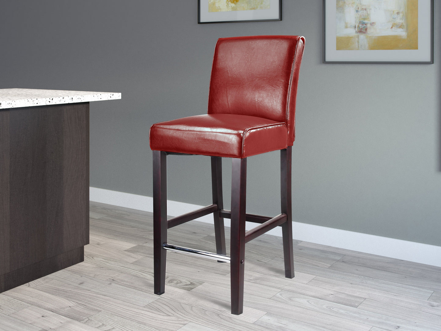 Red wooden bar stool, bar height, with cushioned seat and footrest, perfect for modern kitchen or home bar.