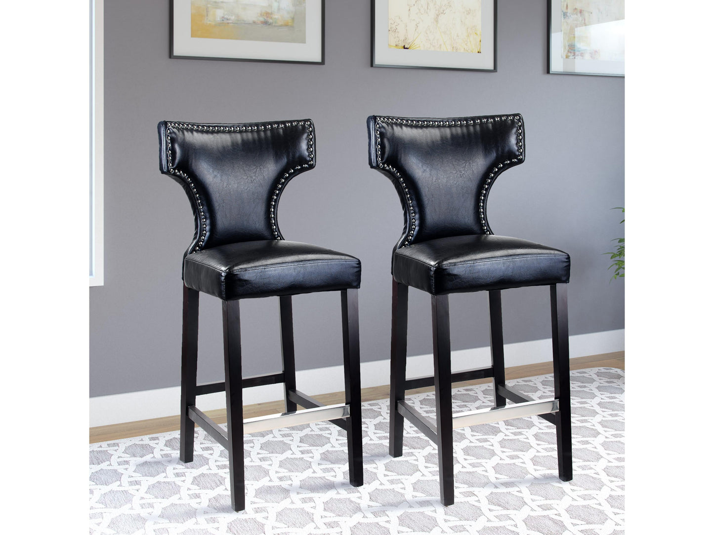 Set of 2 black bar height bar stools with cushioned seats, metal frames, and footrests.