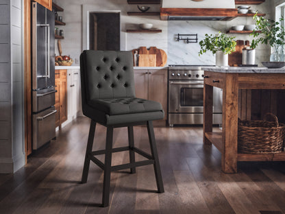 Dark grey button tufted bar stool with wooden legs, cushioned seat, and backrest, perfect for modern kitchens and bars.