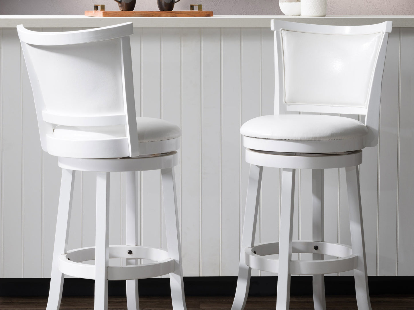 White bar height bar stools, set of 2, with cushioned seats, sleek metal legs, and modern design.