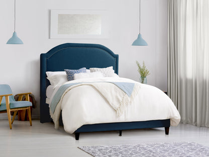 Navy blue upholstered queen bed with tufted headboard, wooden legs, and modern design.