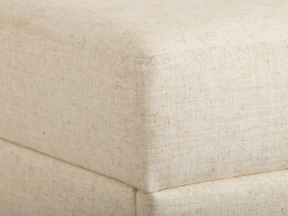 Beige large storage ottoman with tufted top, wooden legs, and versatile modern design.