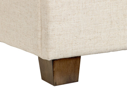 Beige large storage ottoman with tufted fabric, wooden legs, and spacious interior compartment.