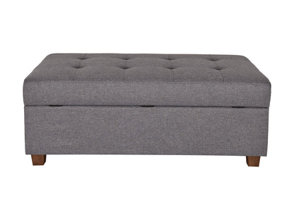 Light grey large storage ottoman with tufted fabric, wooden legs, and spacious interior compartment.