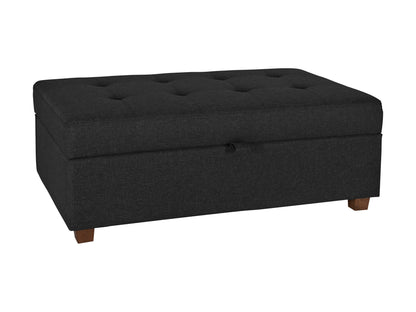 Dark grey large storage ottoman with tufted fabric, wooden legs, and spacious interior.