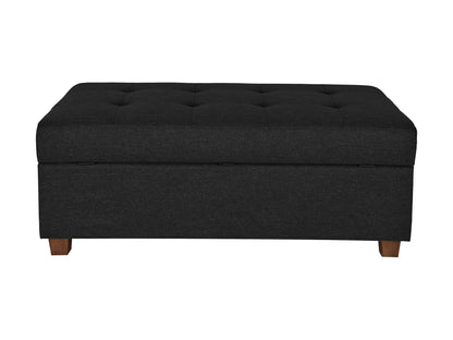 Dark grey large storage ottoman with tufted fabric, wooden legs, and spacious interior compartment.