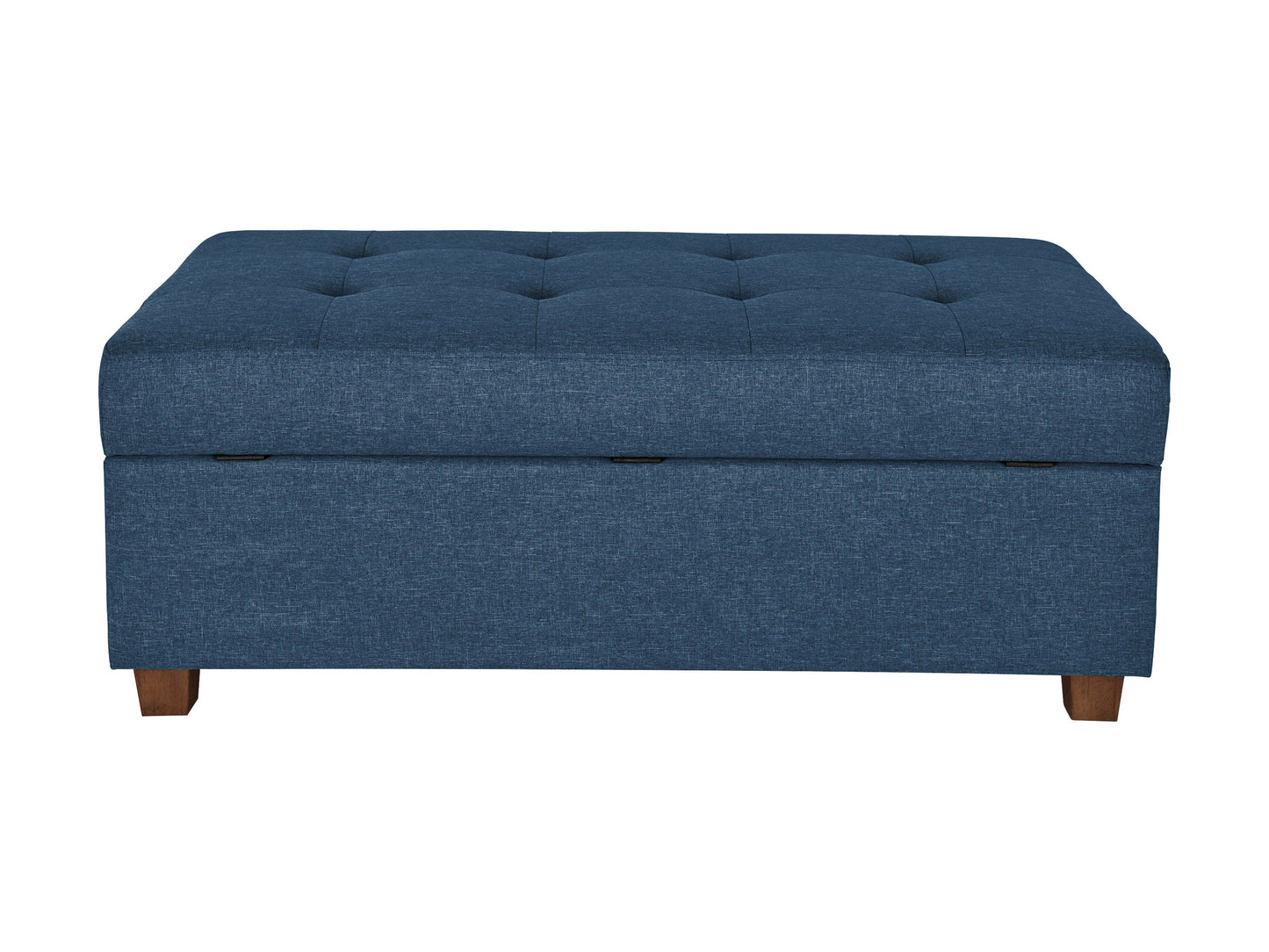 Large blue storage ottoman with tufted fabric, wooden legs, and ample interior space for living room or bedroom.