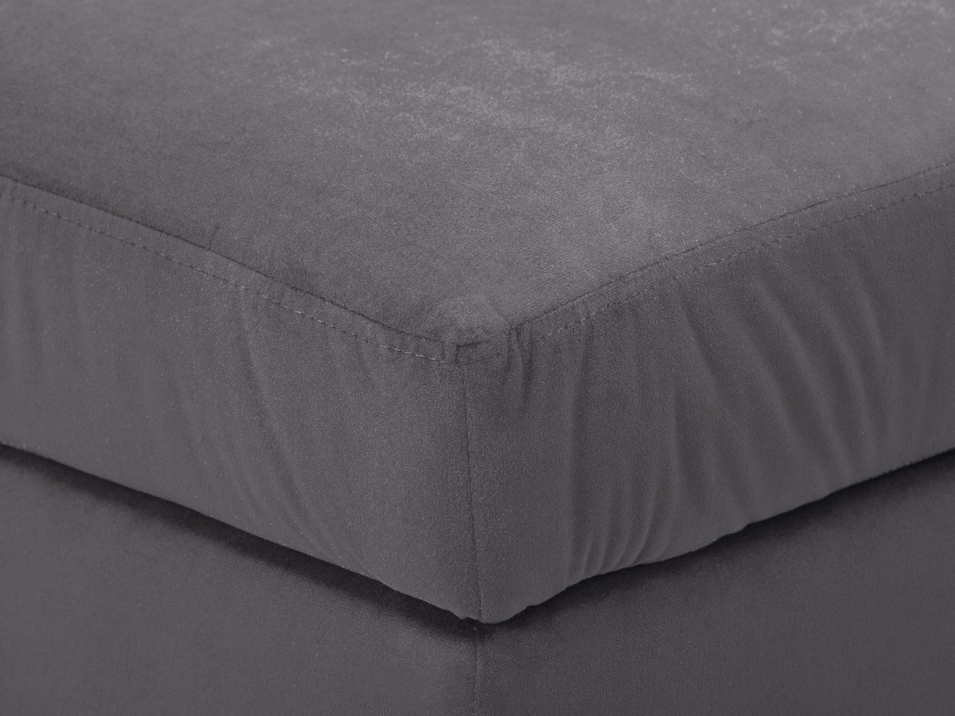 Dark grey velvet storage ottoman with tufted top and wooden legs.