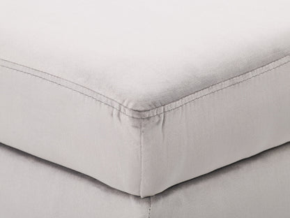 Light grey velvet storage ottoman with tufted top and wooden legs.