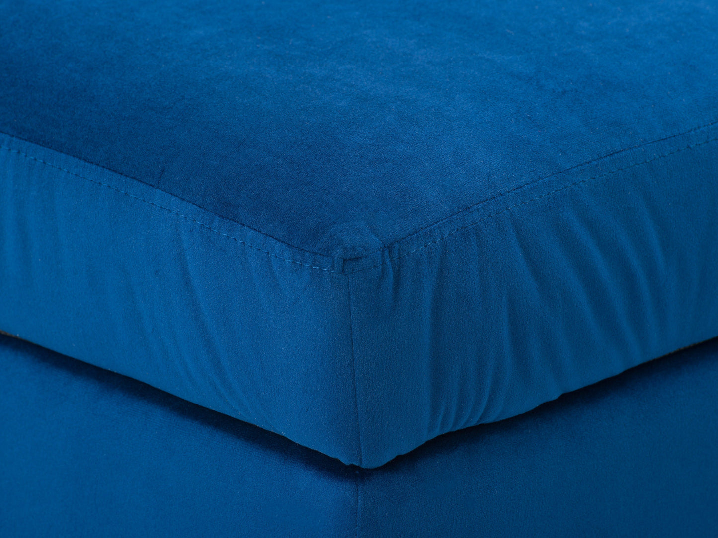 Blue velvet storage ottoman with tufted design and wooden legs.