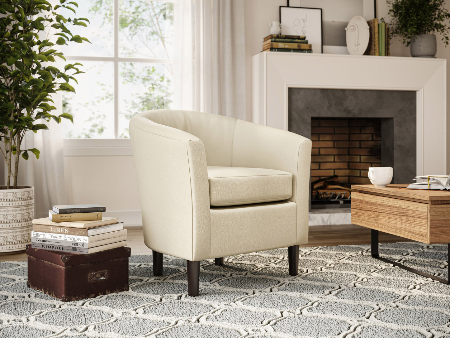 Warm white vegan leather barrel chair with sleek black legs and tufted backrest for modern living spaces.