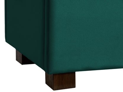 Green velvet storage ottoman with tufted cushion and gold metal legs.