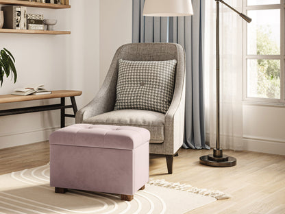 Pink velvet ottoman with storage, tufted lid, and gold metal legs, perfect for modern living rooms and bedrooms.