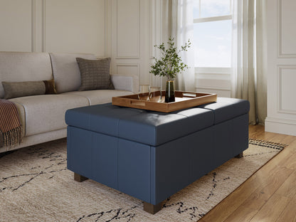 Blue deluxe storage ottoman with tufted fabric, wooden legs, and spacious interior.