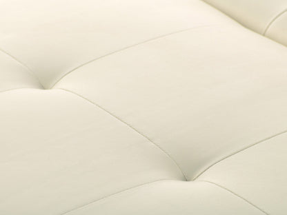 Warm white deluxe storage ottoman with tufted fabric, cushioned top, and wooden legs.