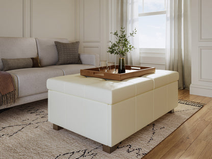 Warm white deluxe storage ottoman with tufted fabric, wooden legs, and hidden storage compartment.