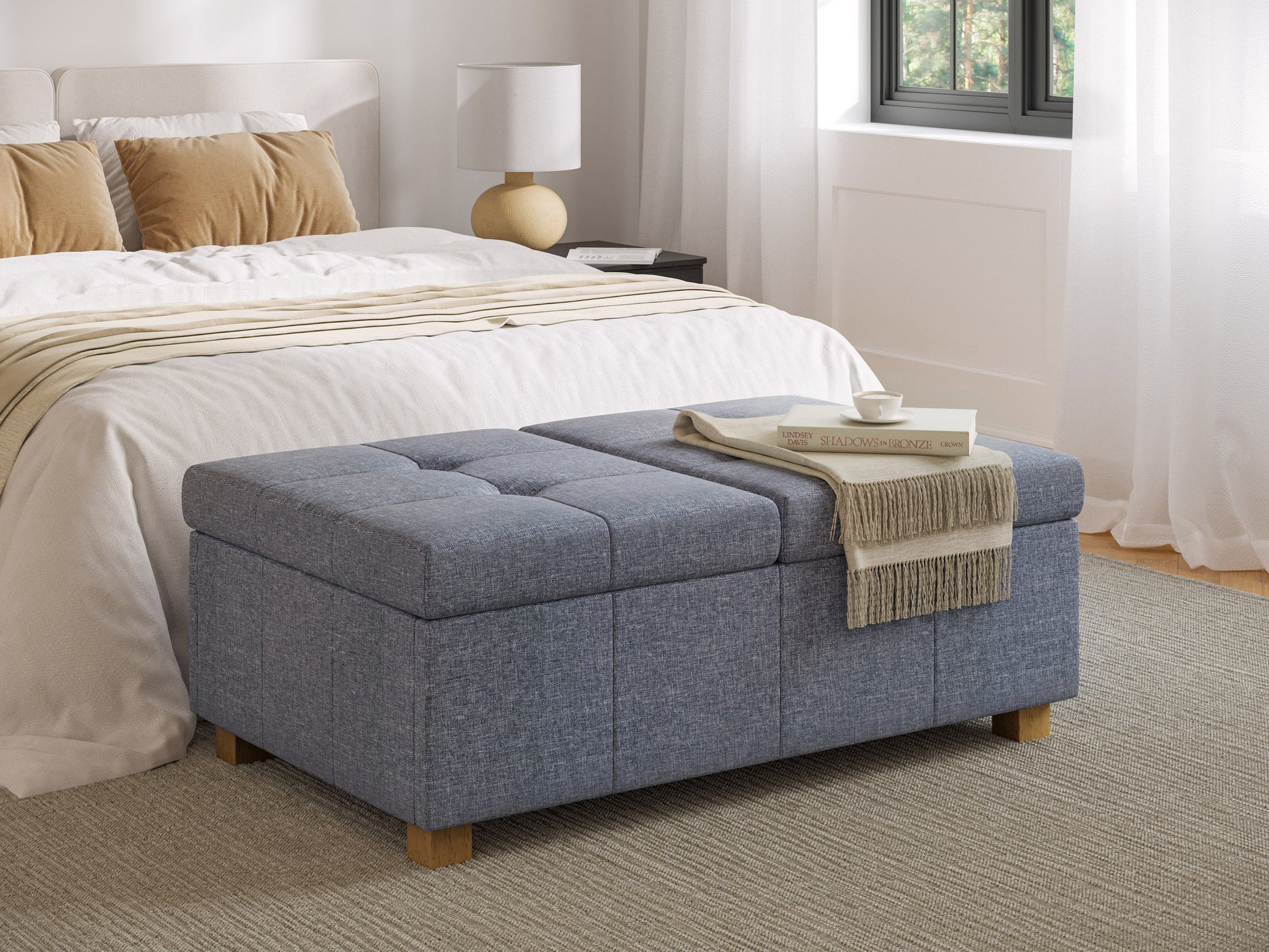 Grey double storage ottoman with tufted fabric, wooden legs, and a spacious interior for versatile home organization.