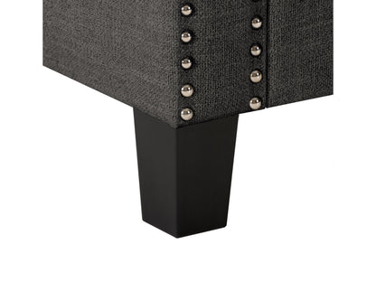 Dark grey storage ottoman with tufted top, fabric upholstery, and wooden legs.