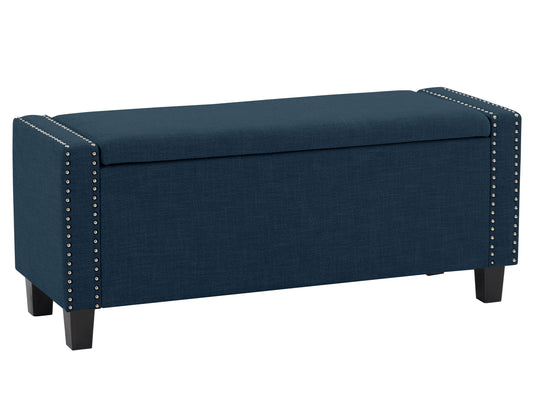 Navy blue storage ottoman with button-tufted fabric, cushioned top, and wooden legs.