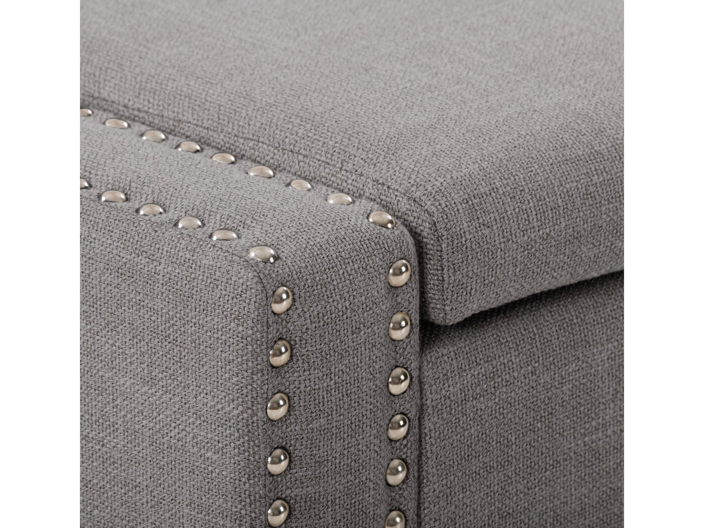 Light grey storage ottoman with tufted fabric, wooden legs, and a versatile design for living room or bedroom.