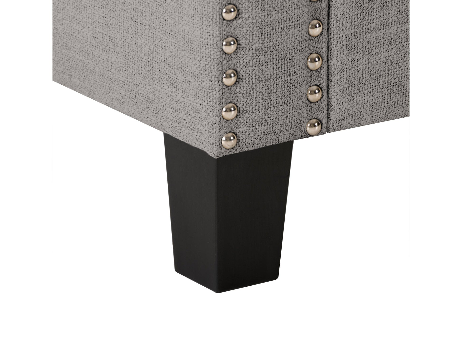 Light grey storage ottoman with tufted fabric, wooden legs, and spacious interior compartment.