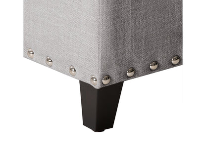 Light grey tufted storage ottoman with soft fabric, wooden legs, and hidden compartment for versatile home decor.