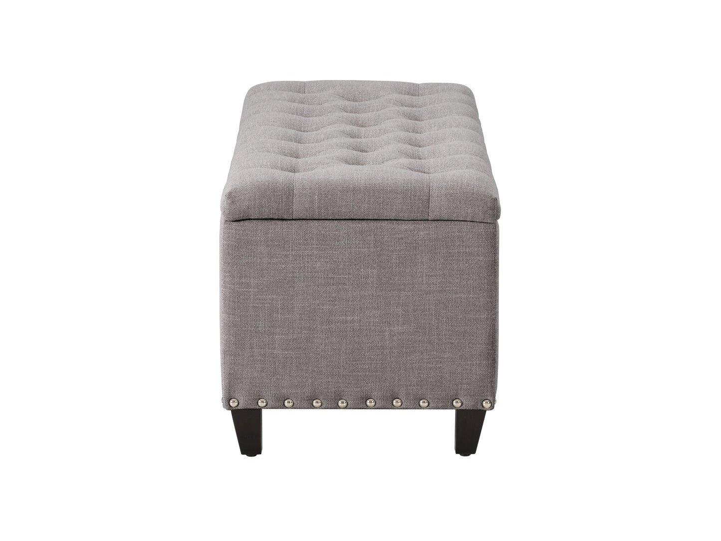 Light grey tufted storage ottoman with wooden legs and soft fabric upholstery.