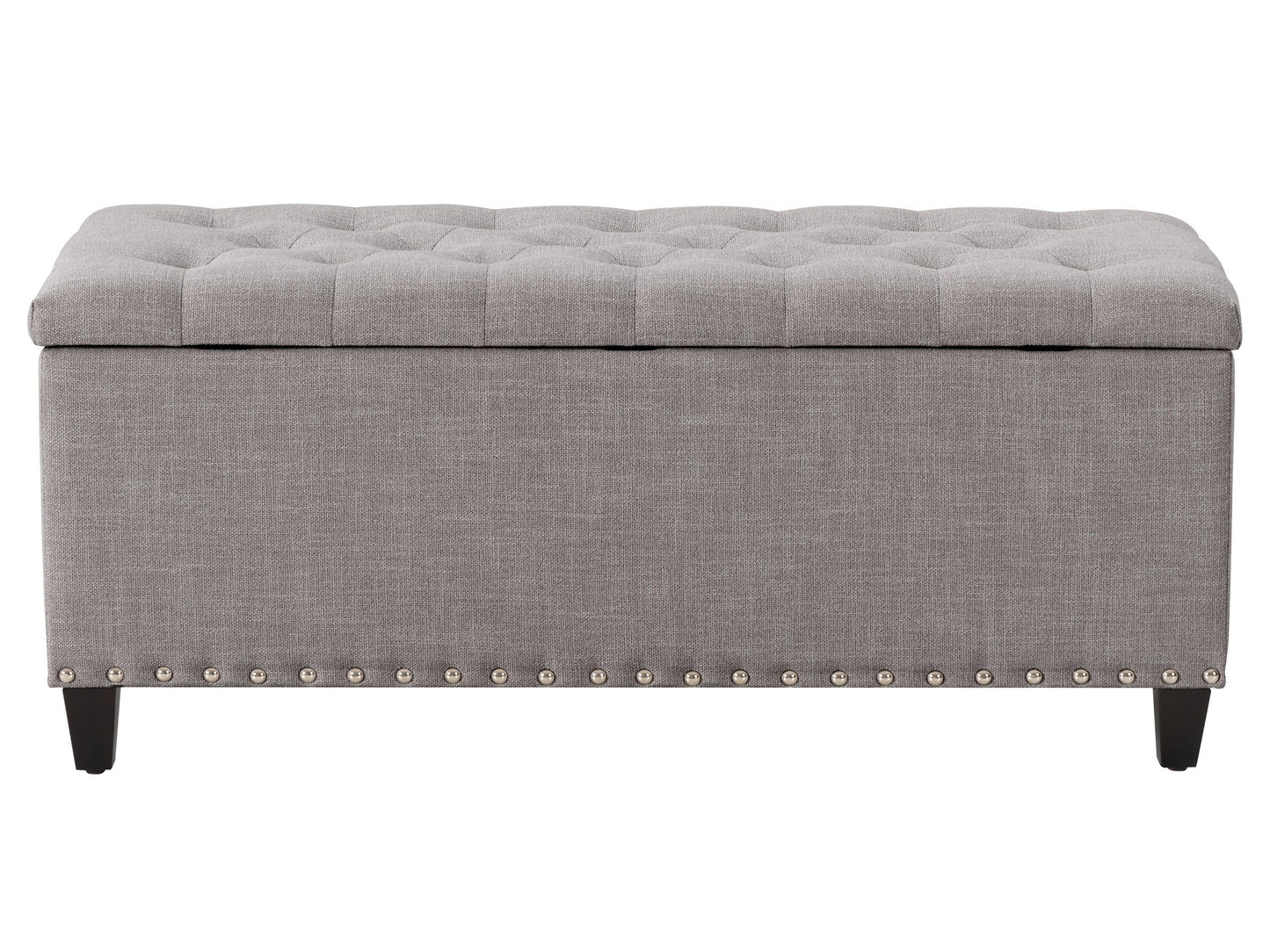 Light grey tufted storage ottoman with wooden legs and soft fabric upholstery.