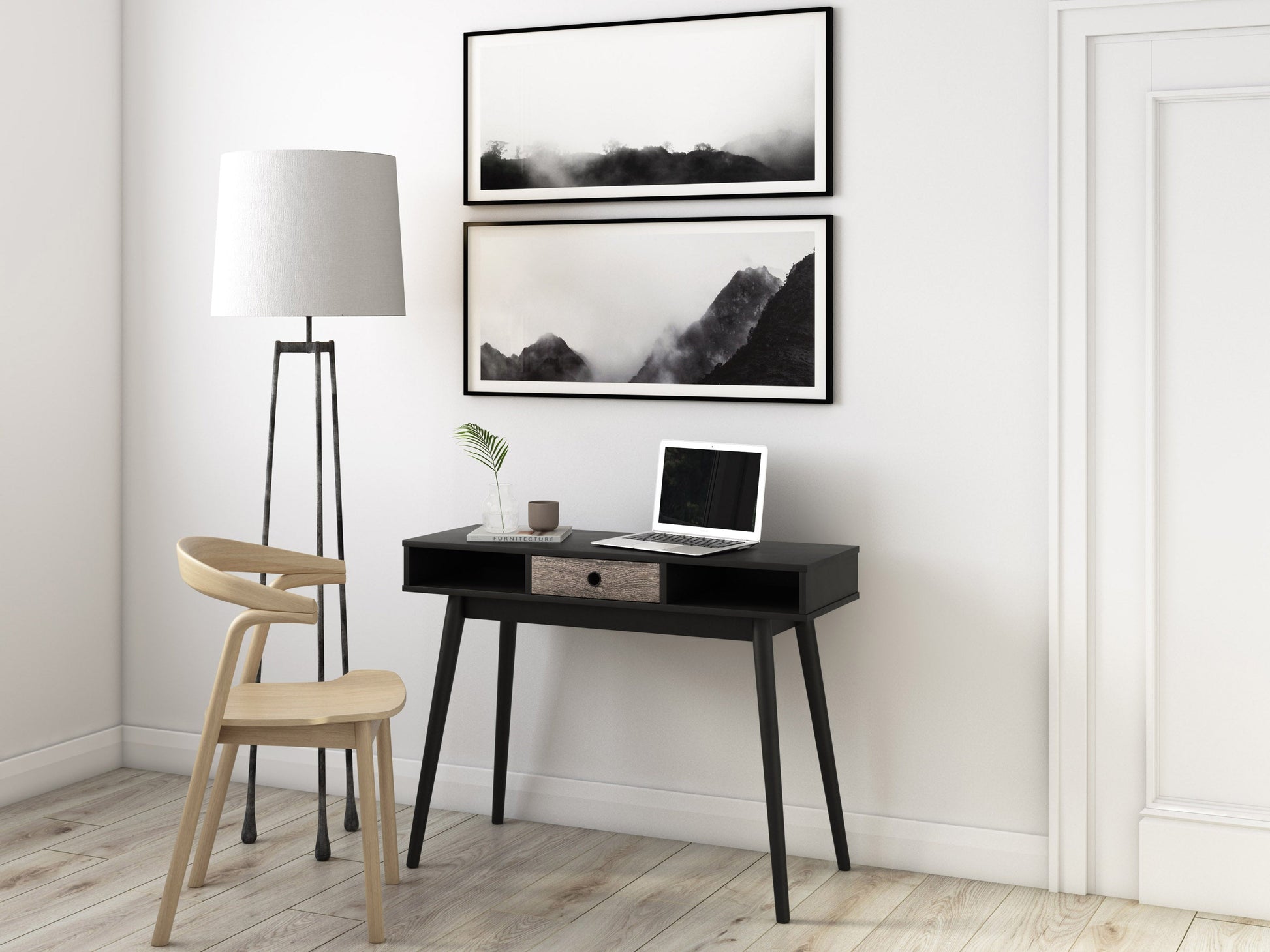 Mid-century black desk with sleek wooden legs, minimalist design, and spacious surface for home office or study.