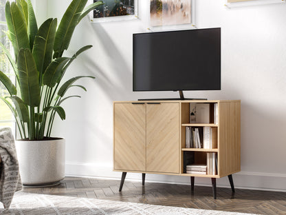 Modern wooden sideboard with natural oak finish, featuring three drawers and two cabinets with sleek black metal handles, set against a white wall with decorative plants and books on top.