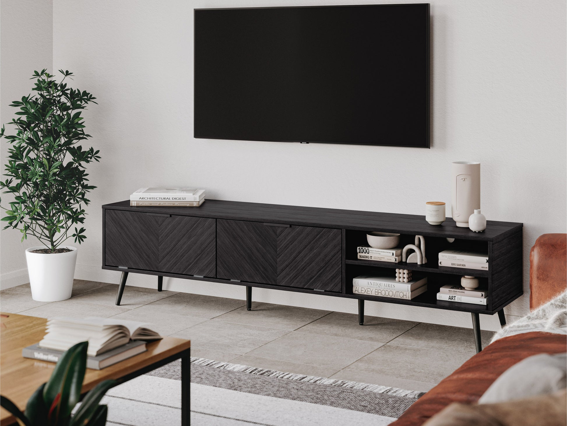 Grey TV stand for TVs up to 85 inches with a sleek, modern design. Features two open shelves and two cabinets with black handles, providing ample storage space. Made of wood with a smooth finish.