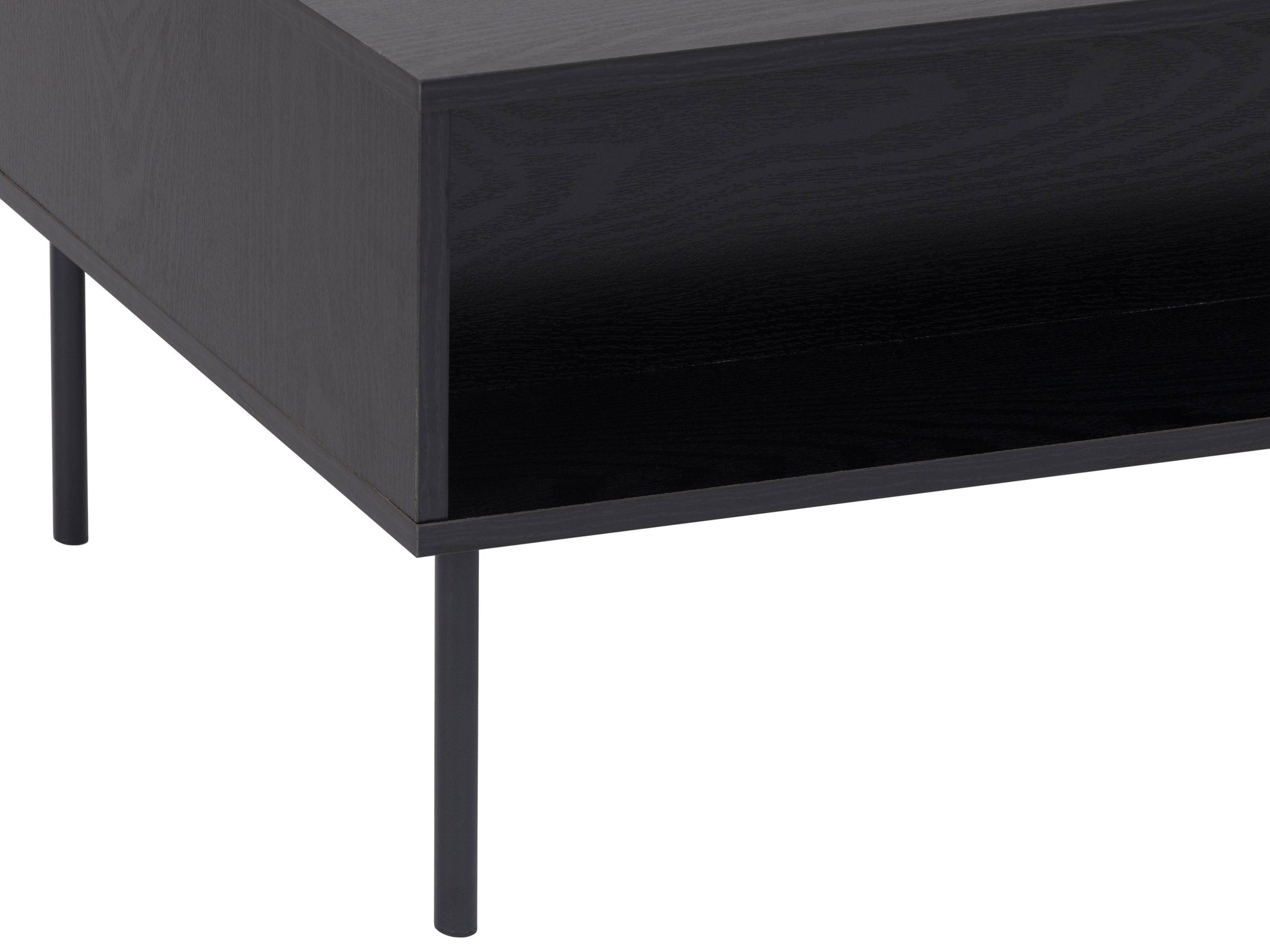 Black fluted coffee table with ribbed texture, round top, and minimalist design for modern living rooms.