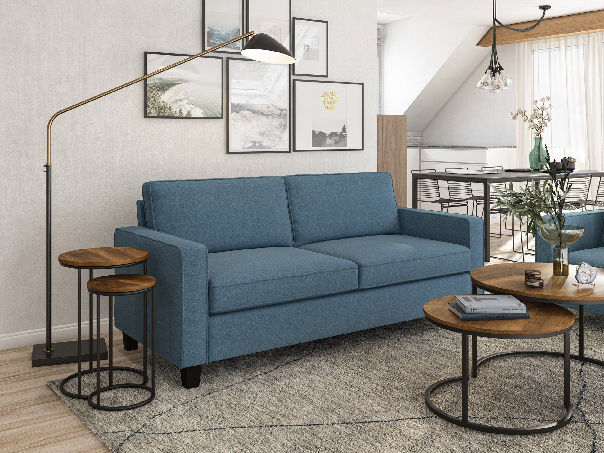 Blue 3 seater sofa with tufted cushions, wooden legs, and modern design.