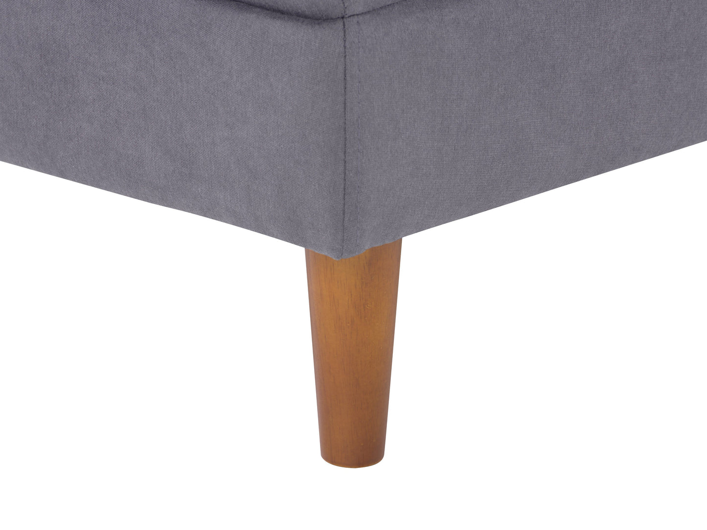 Mid-century modern grey ottoman with tufted fabric, wooden legs, and sleek design.