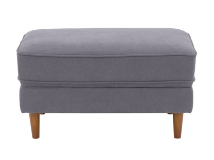 Mid-century modern grey ottoman with tufted cushions and wooden legs.